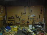 Contents on pegboard, hammers, pipe wrenches, screw drivers, pliers