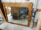 Large mirror with a wood surround, and light bar