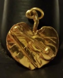 14K YELLOW GOLD CHARM LEAF WITH A FIDDLE ON TOP