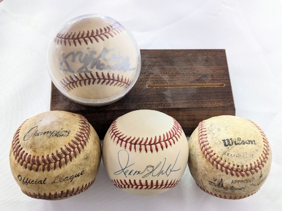 4 BASEBALLS (2 MAJOR LEAGUE) UNKNOWN SIGNATURE ON 1 & WHAT IS BELIEVED TO BE A REPRINT MICKEY MANTLE