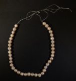 STRING OF CULTURED PEARLS - LIGHT PINK IN COLOR