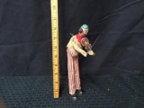 Old wind up toy clown playing violin
