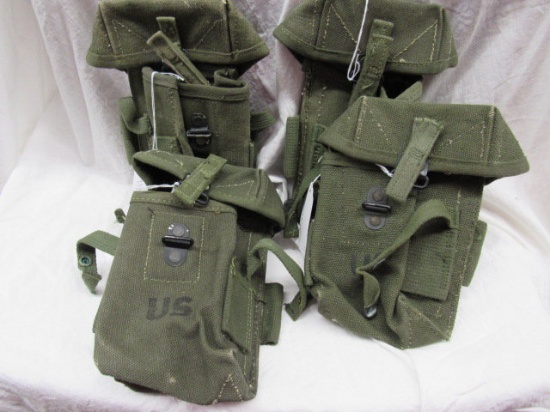 4 vintage military magazine pouches, both marked "US",