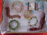 10 Assorted Bracelets. 1 bracelet and earring set.