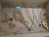 12 assorted necklaces. gold and silver tone