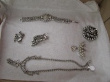 1 Necklace, 1 Bracelet, 2 Pins and 2 Earrings