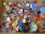 Large box of assorted trinkets, pins, small toys and more