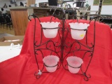 4 Candle holders in folding metal stand.