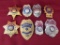 8 Law enforcement metal badges. one has a broken pin.