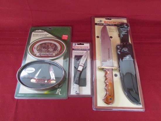 Lot of 3 NIB knives. 2 Winchesters. 1 Remington.