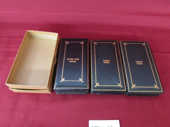 2 cased purple hearts. 1 silver star medal in case-lid hinge is damaged.