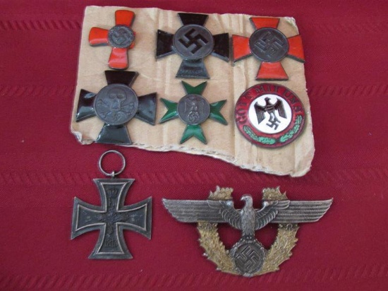 8 German nazi items. badges and medals