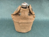 Vintage WWII enamel Canteen with a padded case marked U.S., some