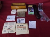 Lot of misc gun related items. trigger lock. trap gun forend. flashlight.