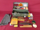 Vintage Tool box full of target shooting and gun cleaning items.