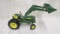 Ertl tractor with front loader has lock lever arm