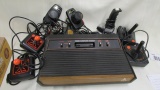 Vintage Atari console with multiple controllers