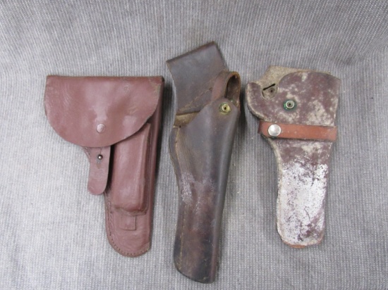 3 leather holsters.