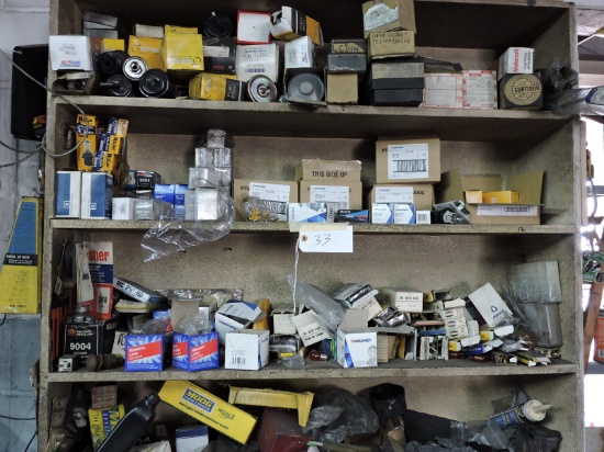 Contents of Upper Shelf: Headlight bulbs, electrical items, fuel filters, etc… -- See Photos