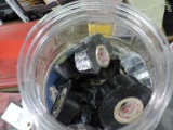 Container of Various Rolls of Black Electrical Tape