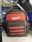 Milwaukee backpack {has a broken strap} filled with hand tools - see photo