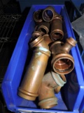 Bin full of a variety of copper tees