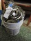 5 gallon pail overflowing with coiled air gun nails