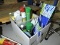 Box of Various Cleaners, Ant Spray, Swifer Parts