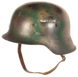 Two M42 Nazi Stahlhelms, Inc. a Tri-Tone Camo Helmet