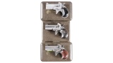 Three Cased American Derringer Corp. Over/Under Derringers