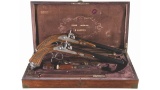 Cased Pair of Engraved and Carved European Percussion Pistols