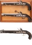 Cased Pair of Grotesque Mask Embellished Flintlock Pistols