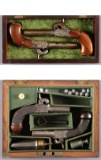 Two Cased Pairs of European Boxlock Percussion Pocket Pistols