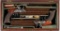 Cased Pair of Over/Under Flintlock Pistols by Samuel Brunn