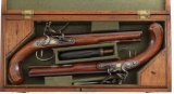 Cased Pair of Silver Mounted Wogdon Flintlock Dueling Pistols