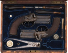 Cased Pair of Engraved Deane, Adams & Deane Over/Under Pistols