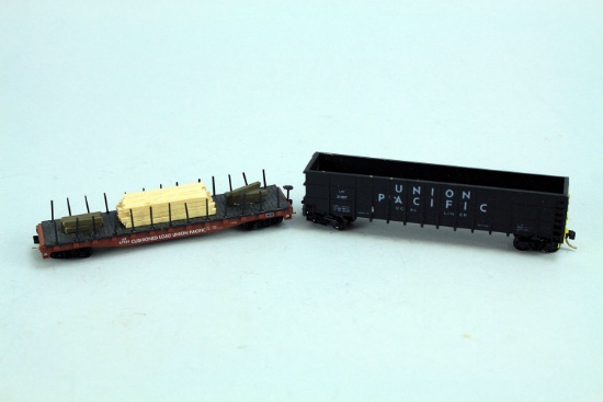 2 N Scale Micro-Trains Union Pacific Cars; 1) UP 57919 Flat Car w/rails, 2) UP 31907 Open Coal Car