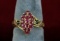 10K Gold Ladies Ring w/ Ruby Colored Stones, Sz 5