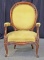 Oval Back Upholstered Arm Chair w/ Carved Details