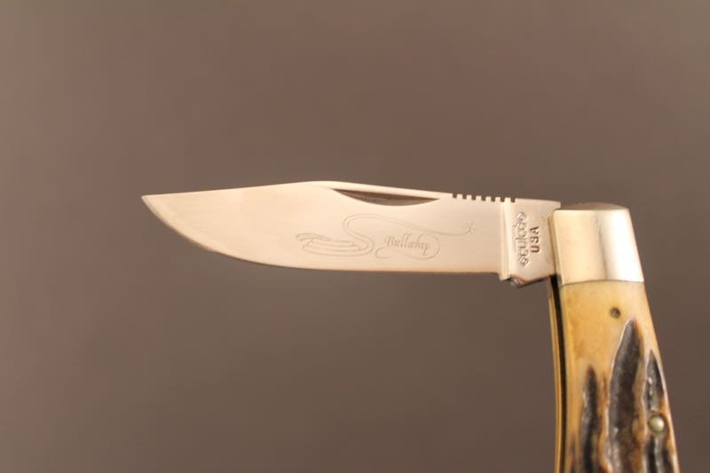 Sold at Auction: CUTCO CUTLERY SPORTSMAN'S KNIFE WITH SHEATH