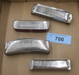 flat of 4 Vintage Harmonicas