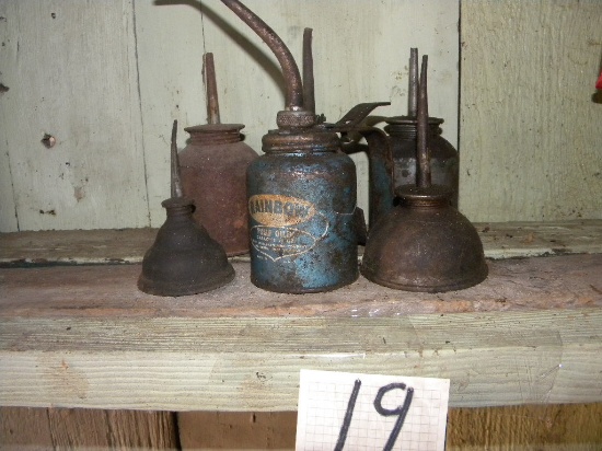 Seven (7) Antique Oil Cans.
