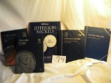 Coin books.   Jefferson Nickels; Washington Quarters; Jefferson Nickels; Lincoln Cent.