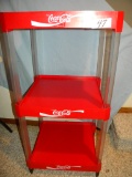 Coca Cola= Three Tier Plastic Organizer Stand.