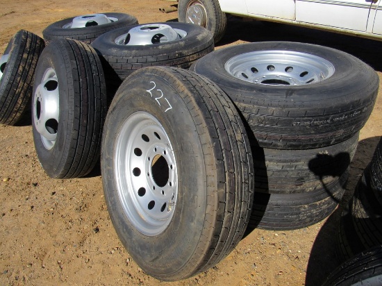 Set of 4 unused 235/80R16 tires & 8 hole wheels