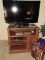 Hitatchi flatscreen TV w/cabinet & contents