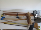 Lot of misc brooms, rake, shovel & handles