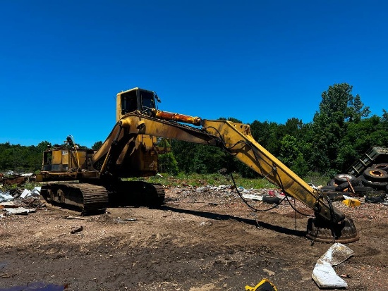 Caterpillar 235 Track Excavator High rise cab, hydraulic thumb, 36' track, 24,056 hours showing.