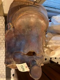 Vintage saddle with one stirrup