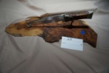 Baskett Display Hunting Knife on Burled Wood.